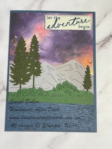 Handmade layered card with scenic adventure scene in gray, blue, and green tones