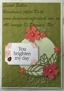 Bright handmade celebration card featuring springtime scenes with vibrant colours and layered details
