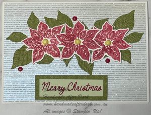 Poinsettia Christmas Card with a sparkly background, red poinsettia and green leaves