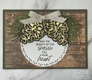 Rustic card with gold detailed pinecones on an embossed woodgrain background
